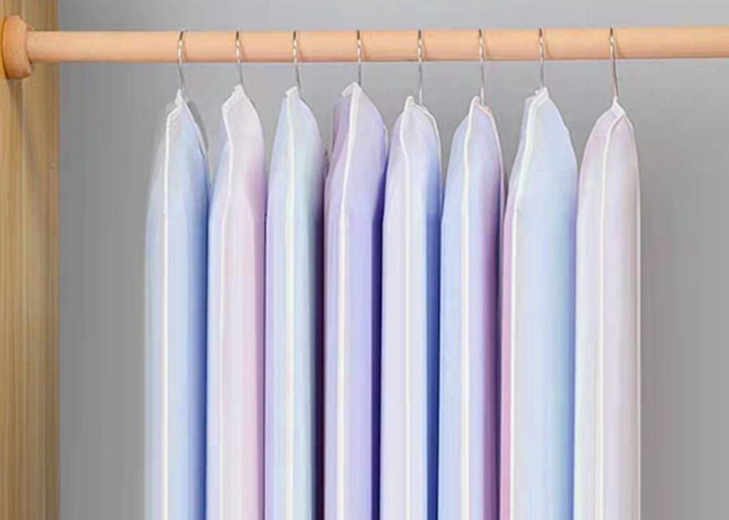 Garment bags hanging on rail