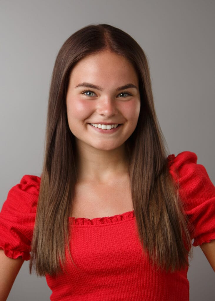 Actor headshot girl in red top